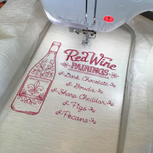 Load image into Gallery viewer, Red wine pairings cushion in embroidery frame
