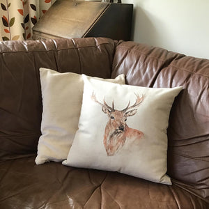 Stag Watercolour Cushion on sofa