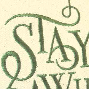Stay Awhile Cushion close up of the word Stay