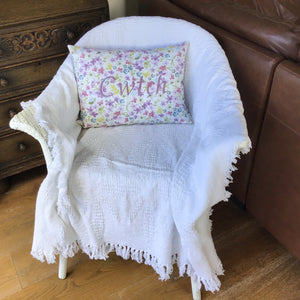 Cwtch Cushion Watercolour Lilac on chair